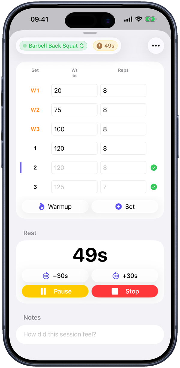 A live session: warmups (W1–W3) above your working sets, the Warmup and Set buttons, and the rest timer below.